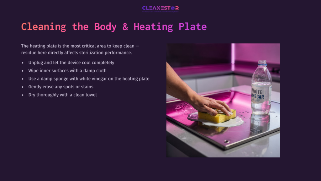 A Hand Scrubbing A Philips Avent Sterilizer'S Heating Plate With A Yellow Sponge, Accompanied By A Bottle Of Vinegar On A Purple Background.