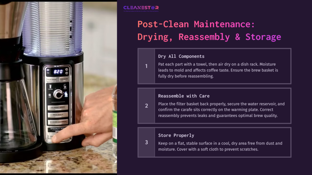 A Close-Up Of A Hand Drying A Ninja Coffee Maker'S Water Reservoir On A Counter, With Cleaning Instructions Visible In The Background.