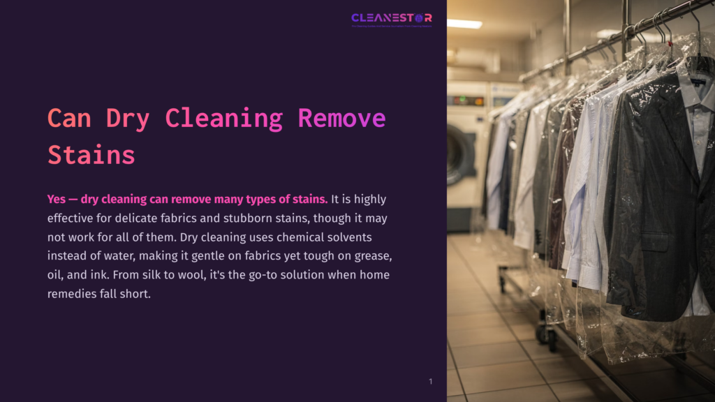1 Can Dry Cleaning Remove Stains Can Dry Cleaning Remove Stains?&Quot; Text Overlaying A Photo Of A Row Of Suits And Jackets Hanging In Clear Plastic Garment Bags In A Professional Laundry Facility, With Washing Machines Visible In The Background.